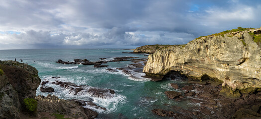 Stunning marine view of rocky coastline near Waenhuiskrans, Arniston, Overberg, Western Cape, South Africa. Dramatic cliffs, ocean waves, pristine landscape perfect for nature and travel projects.