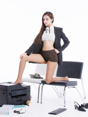 Asian pretty young cute woman confident long hair in office costume standing poses playfully with large printer, beside chair books keyboard landline phone in white studio fashion stylish emotional.