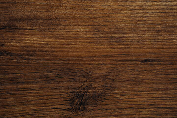 Dark brown hardwood texture with flowing grain and deep natural lines