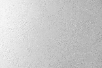 Textured white wall with subtle patterns ideal for backgrounds or displays