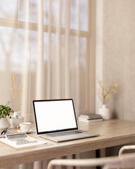 White screen laptop with coffee cup and calculator on wooden table aside window with sheer curtain.