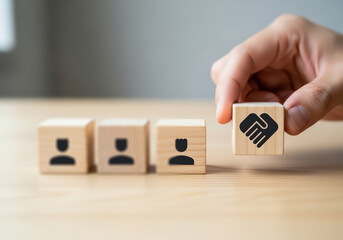 Concept of empathetic leadership — wooden cube illustrating connection, understanding, and trust between team members, reflecting emotional intelligence, collaboration, and supportive workplace relati