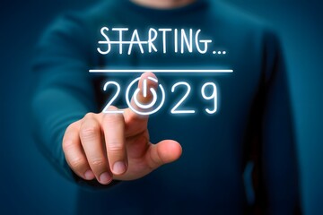 A finger pressing starting 2029 button on blue background for new year or future concept design