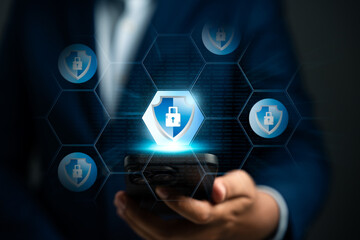 Cyber security and data protection for business, Businessman using smartphone with padlock and shield icon, Encryption security and safeguard business and financial data. Cloud computing protection.