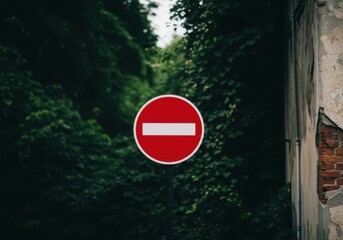 A red and white no entry sign is displayed in a dark forest setting