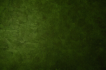 Olive green grunge wall with rough aged plaster texture