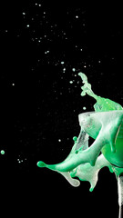 Dynamic splash of mint green creamy cocktail with foam texture. Concept of creativity and freshness...