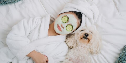 Woman relaxing with dog doing self-care spa treatment