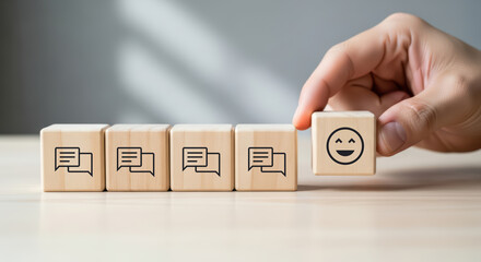 Positive customer satisfaction concept. Wooden cube with a happy face standing out among blocks with speech bubble icons, symbolizing positive feedback and quality service