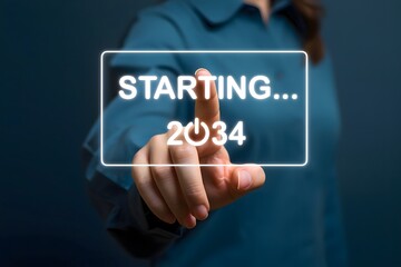 Finger touching starting 2034 button on transparent screen in front of a person with blue shirt