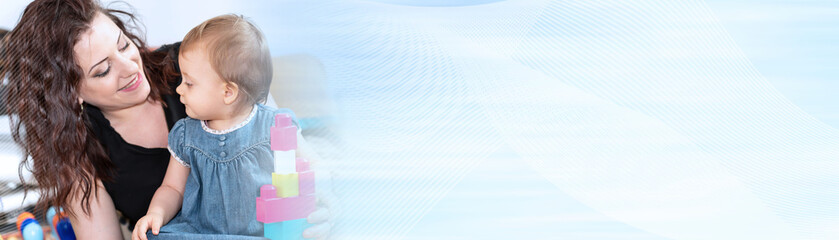 Mother playing with her baby girl; panoramic banner