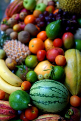 Assortment of ripe fruits with pineapple and grapes.