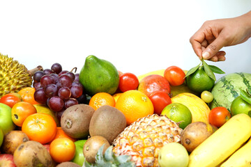 Variety of ripe tropical fruits full frame. white background.