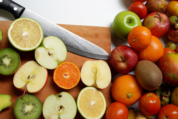 Fruit cut on cutting board with knife. fruit photography