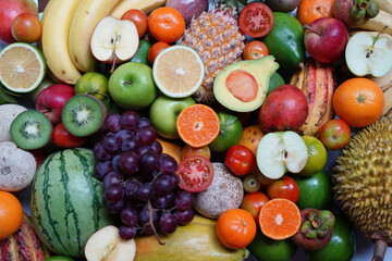 Colorful collection of ripe tropical fruits.