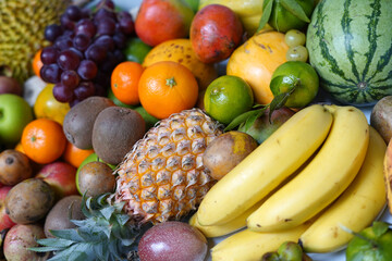 Juicy fruits assortment including mango and pineapple.