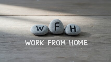 A stone pebbles engraved wfh on rustic wooden table showing remote work and technical support and customer service