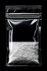  black resealable pouch with white silica gel desiccant packet product photography on dark background