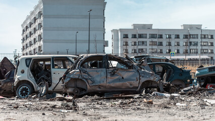 destroyed and burned cars in the city of Kiev during the war in Ukraine