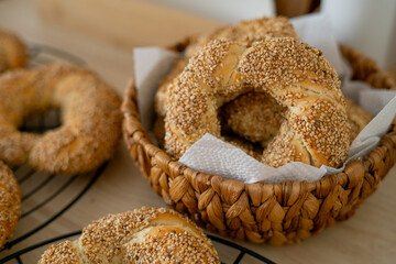 Hot homemade Turkish simit in the kitchen. Bagels with sesame seeds. Pastries.