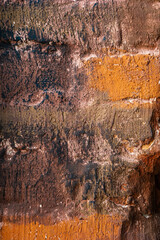 Orange and brown artistic wall texture with paint strokes for abstract design and creative backdrop concept