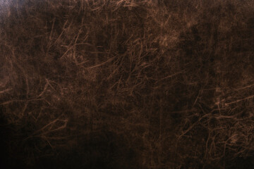 Closeup of brown distressed leather texture for vintage material background and design detail