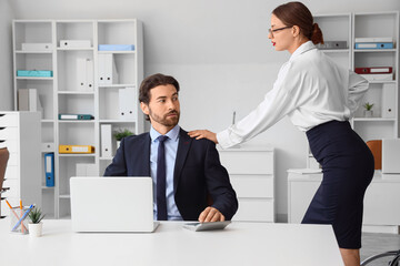 Sexy young secretary seducing her boss in office