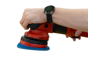 Car detailing series: Polishing car. A master polishes the surface of a car body. Master repairman polishing body of car in workshop using polishing machine. Repair after an accident. PDR. 