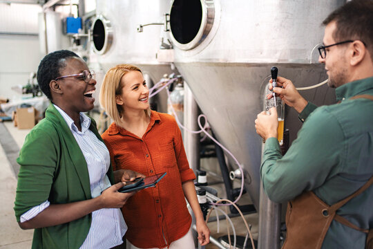 People tasting craft beer during brewery tour