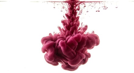 Pinkishpurple ink disperses downwards in white water creating a voluminous swirling effect