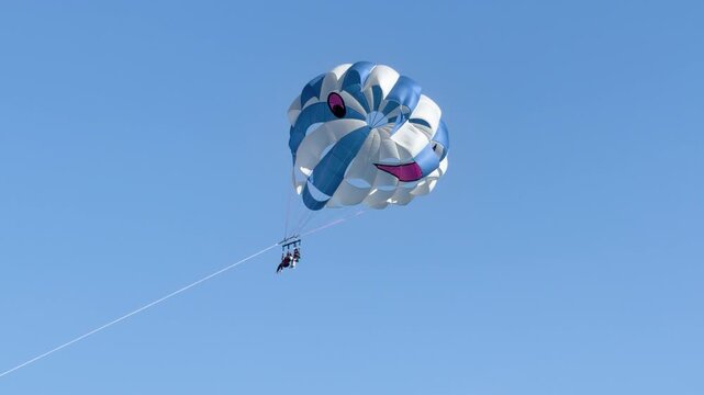 Tandem Parasailing Over Clear Blue Sky in Gold Coast