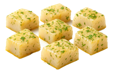 Golden-hued dried apple slices with a glossy sheen fanned out on a parchment-lined baking sheet