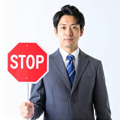 STOPサインを出すビジネスマン