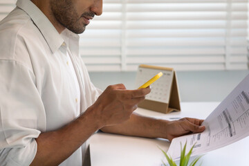 business man use phone to scan barcode or QR codes to pay credit card bill after receiving document invoice online. payment, receive, paying electricity, digital payments without money, technology