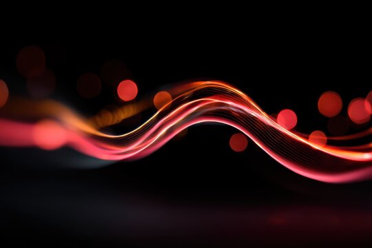 Abstract glowing red wave with blurred lights on black