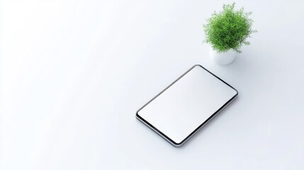 A minimalist setup featuring a tablet on a clean surface next to a small potted plant, creating a serene and modern workspace atmosphere.