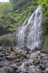 Portrait Of Three Adventures Friends Exploring Waterfall