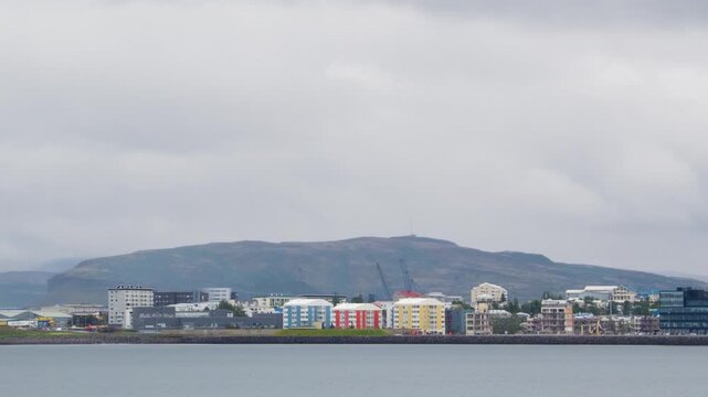 Reykjavik, Iceland. View of the Reykjavik, Iceland skyline during a cloudy summer day. Time-lapse, panning video