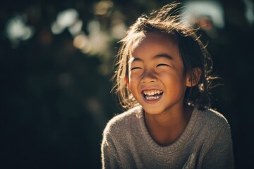 Candid outdoor portrait of child with missing teeth