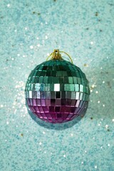 Festive Disco Ball on Glittering Blue Background for Holiday Celebrations and Christmas Decorations.