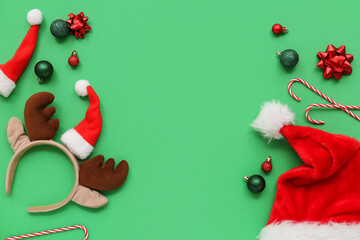 Christmas reindeer antlers headband with Santa hats and baubles on green background