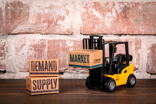 Forklift Lifting Market Box Near Demand and Supply Box Representing Business and Economy Concept - Powered by Adobe