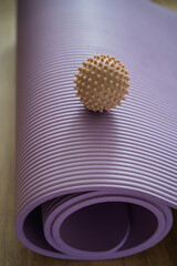 Massage ball and yoga mat. Home sports. Health.