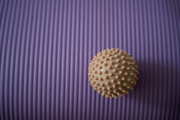 Massage ball and yoga mat. Home sports. Health.