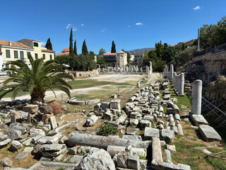 Scenic view into the Theatre of Herodes Atticus with Athens city skyline and blue sky on a sunny day, ancient stone textures and Greek heritage architecture.