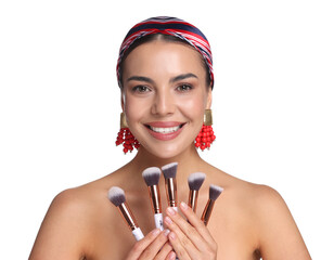 Beautiful woman with makeup brushes on white background
