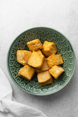 Overhead view of fried tofu, top view of pan fried soya bean tofu cubes