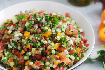 A bowl with traditional Israeli Salad