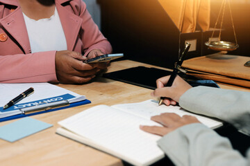Consultation and conference of professional businesswoman and Male lawyers working and discussion having at law firm in office. Concepts of law, Judge gavel with scales of justice