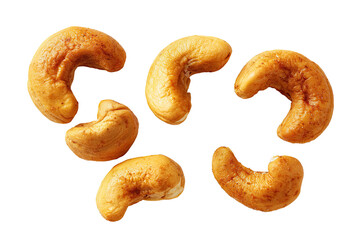 Fototapeta premium Close-up view of six golden, roasted cashew nuts, isolated on a transparent background